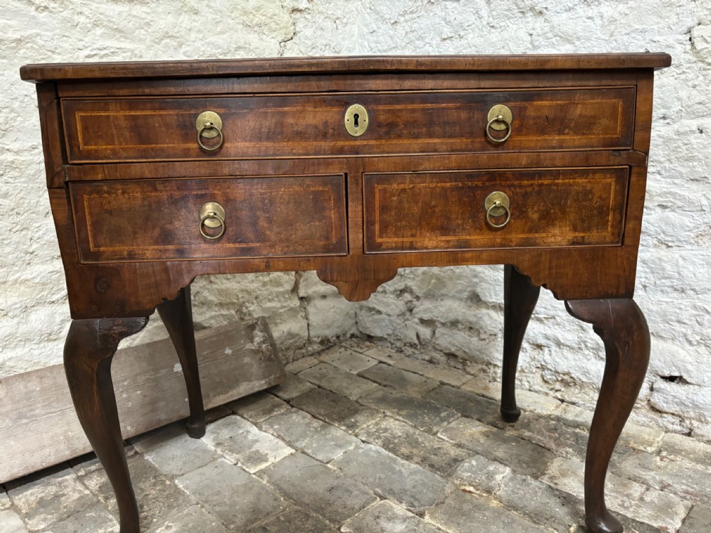 Georgian walnut and cross banded Lowboy View III