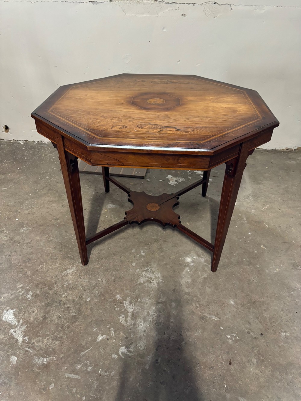 A late Victorian rosewood inlaid and crossbanded centre table
