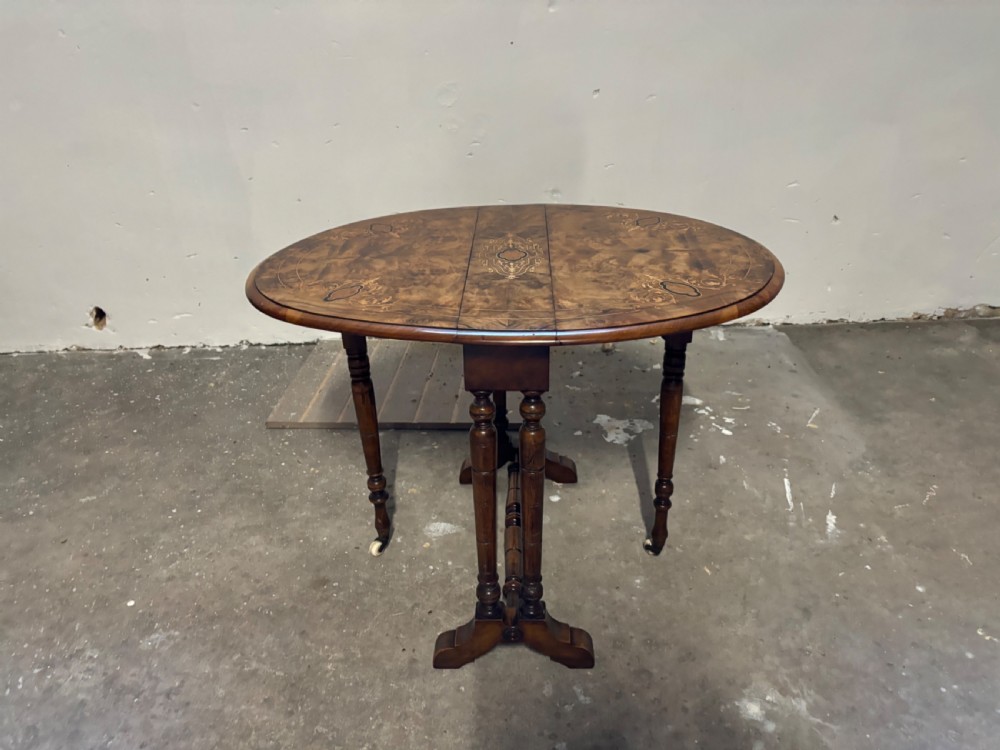 A Victorian Burr Walnut and inlaid Sutherland Table