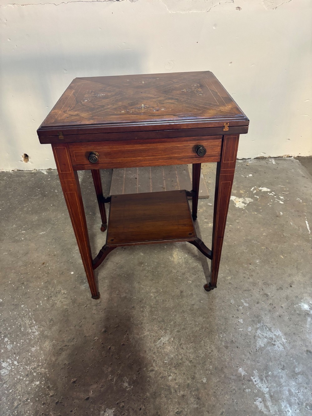 An Edwardian Rosewood and inlaid Envelope Card Table