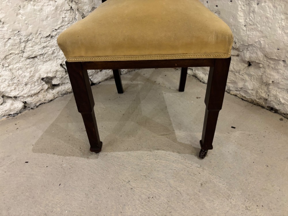 An Edwardian dark mahogany high-backed side chair featuring Art Nouveau floral marquetry inlay on the backrest and a light yellow upholstered seat. View III