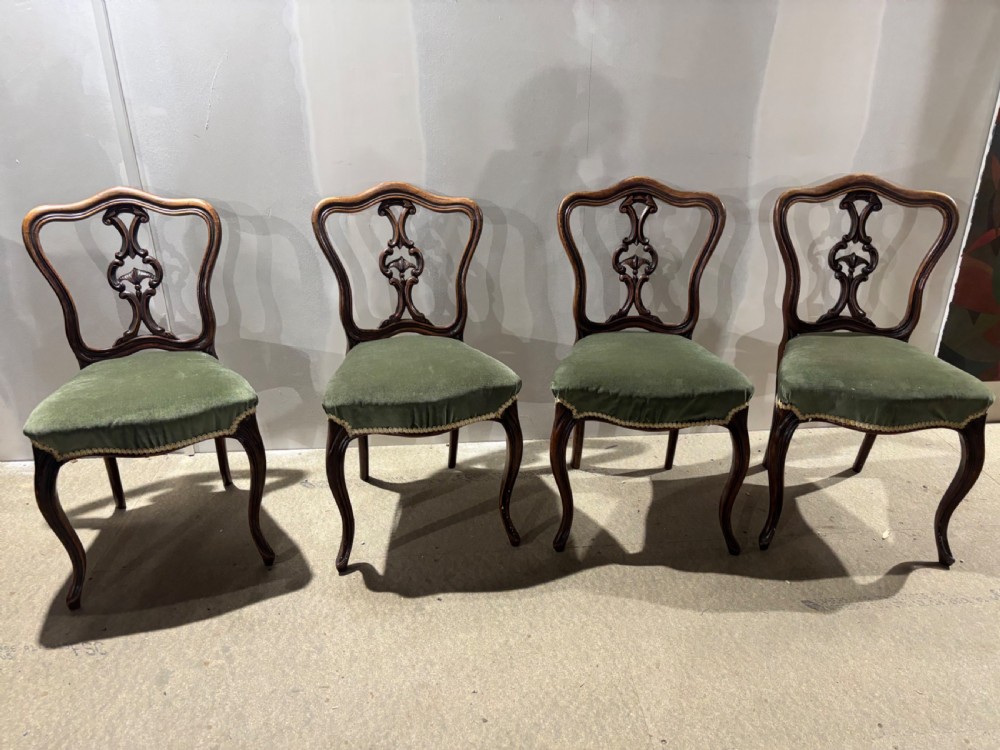 A Set of Four Victorian Walnut Dining Chairs
