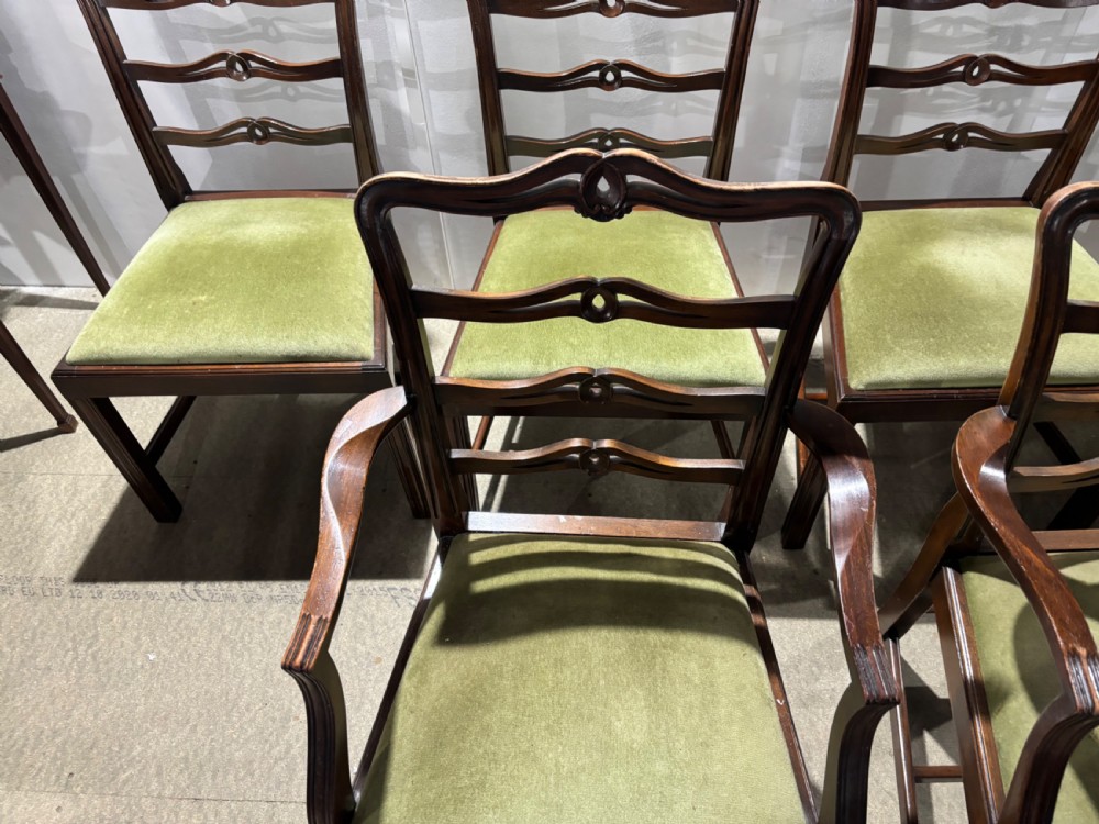 A set of six dark mahogany ladderback dining chairs, including two carvers and four side chairs, featuring serpentine carved splats and green velvet seats. View II