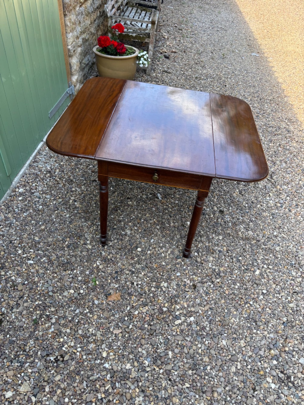 A Victorian mahogany Pembroke table with extended drop leaves and turned wood legs. View III