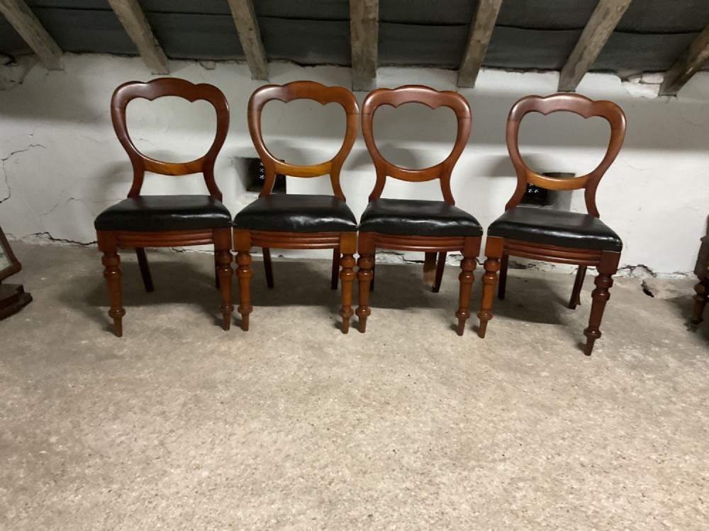 A Set of Four Victorian Balloon Back Dining Chairs