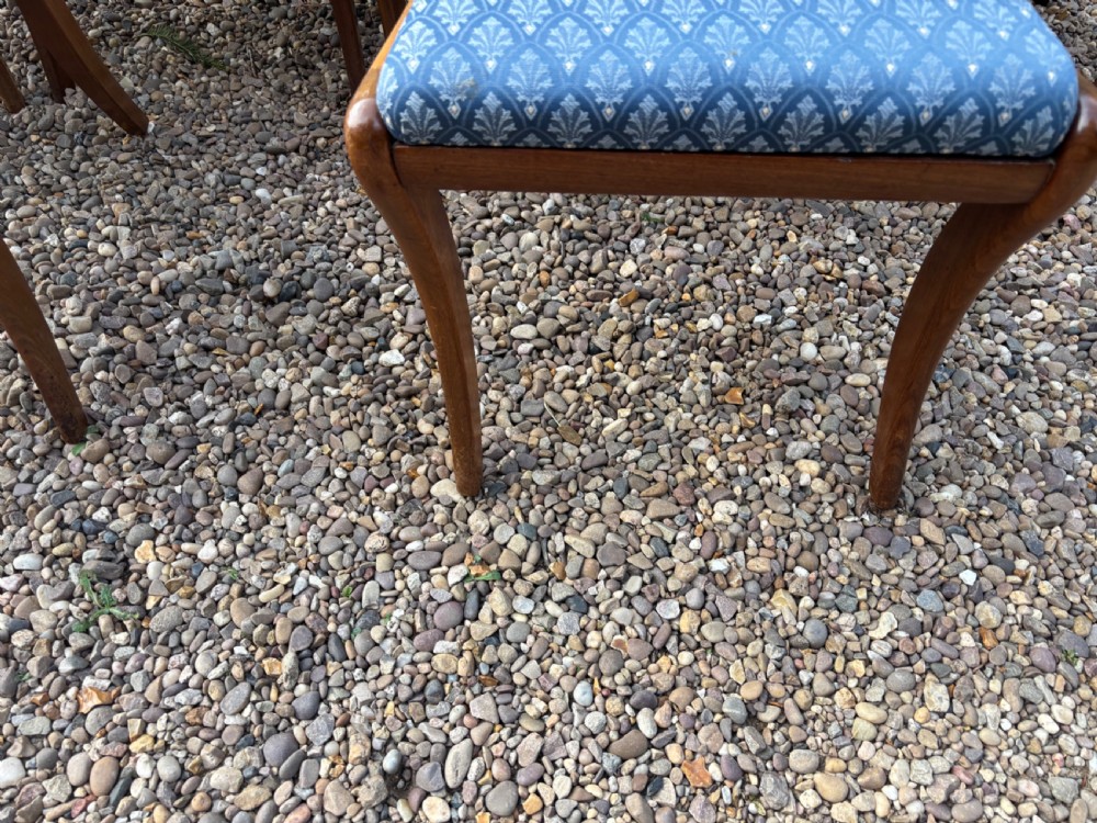 A set of six Regency mahogany dining chairs featuring scrolled top rails, turned horizontal crossbars, and blue patterned upholstered seats. View III