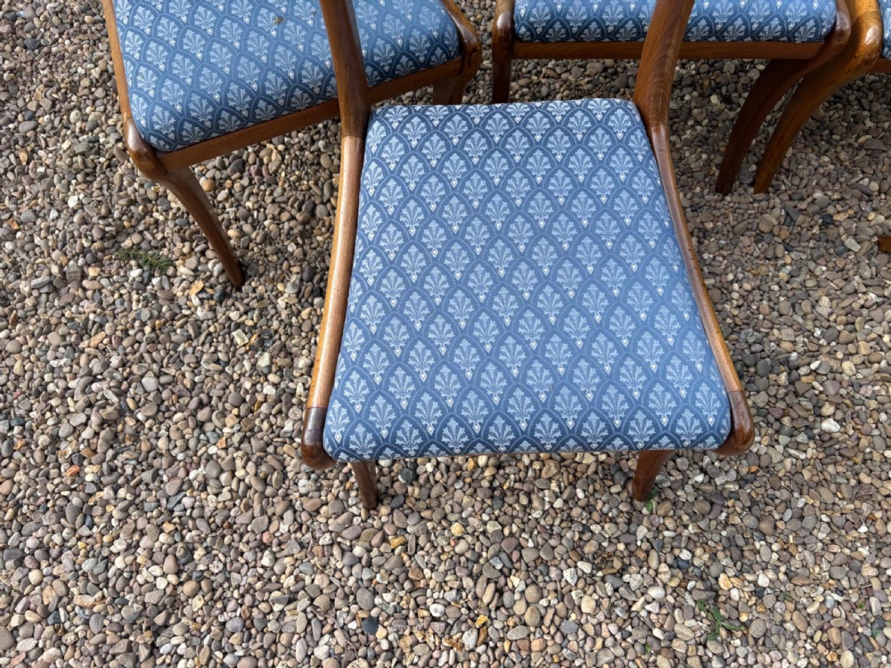 A set of six Regency mahogany dining chairs featuring scrolled top rails, turned horizontal crossbars, and blue patterned upholstered seats. View VI