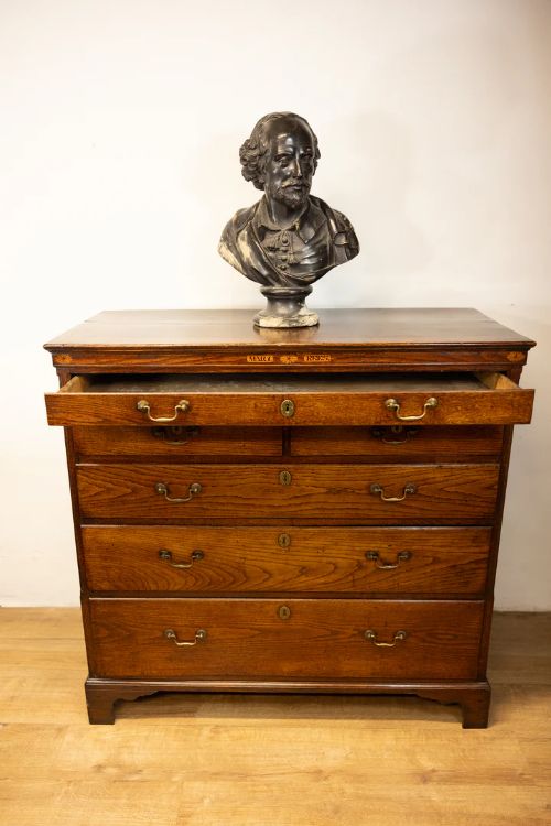 fig 2. An unusual George III oak chest of drawers with the name