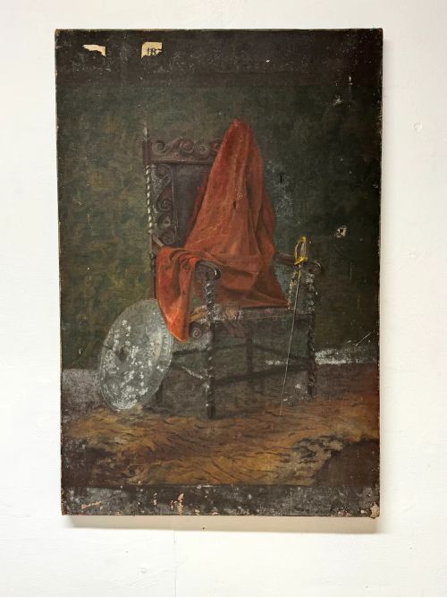 fig 2. An unframed 19th-century oil painting on canvas depicting a still life scene with a carved 17th-century style chair, draped red fabric, a sword, and a shield.