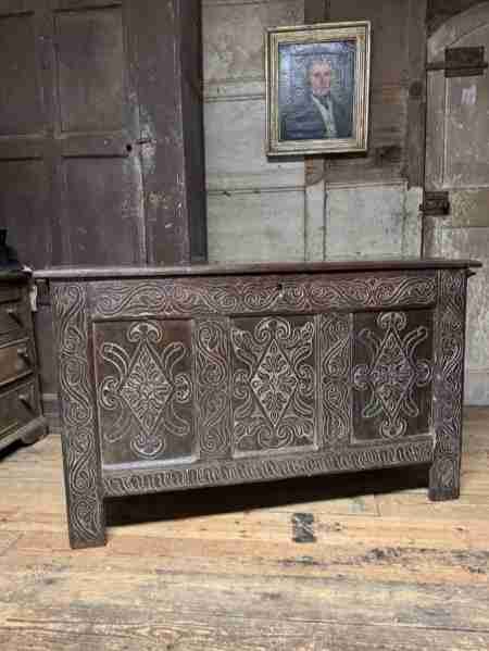A 17TH CENTURY OTTERY ST MARY EXETER JOINED OAK CHEST FROM THE SAME WORKSHOP IN WHICH THOMAS DENNIS APPRENTICED 1687