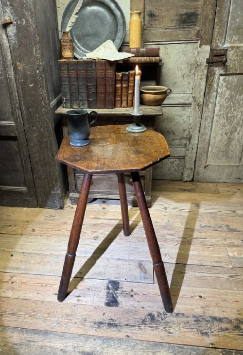 AN 18TH CENTURY PRIMITIVE OAK SLAB TOP OCTAGONAL CRICKET TABLE OF EXCEPTIONAL COLOUR View II