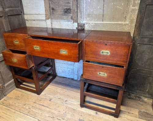 fig 4. Late 19th-century Anglo-Indian campaign desk crafted from rich reddish-brown timber with flush brass handles and open frame bases.