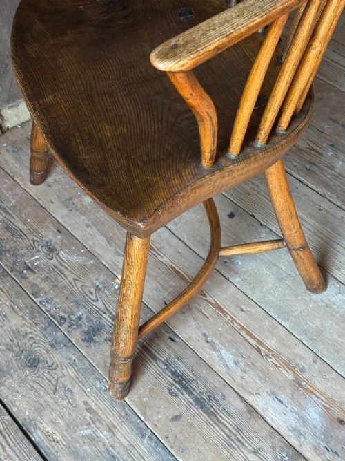 A George III West Country Windsor armchair made of elm and ash wood, featuring a spindled backrest, shaped timber seat, turned legs, and a cow-horn stretcher. View VIII