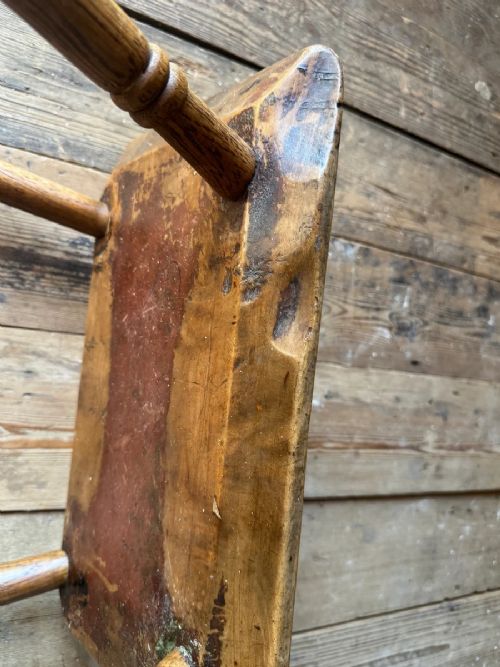 An early 19th-century rustic wooden stool featuring a rectangular sycamore seat top with visible wedged through-tenons and four splayed ash legs. View IX