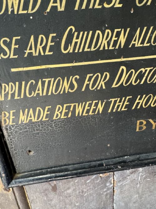 fig 2. A black rectangular wooden notice sign framed in timber featuring gilded hand-painted lettering with instructions for the City of Leicester.