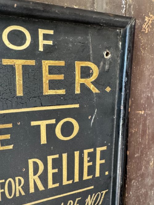 fig 4. A black rectangular wooden notice sign framed in timber featuring gilded hand-painted lettering with instructions for the City of Leicester.