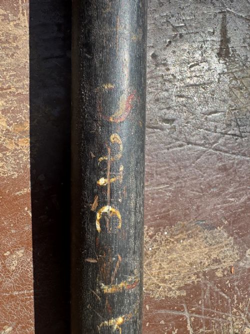 A dark turned wooden George III cudgel featuring hand-painted lettering that reads God Save The King. View VI