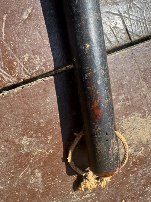 A dark turned wooden George III cudgel featuring hand-painted lettering that reads God Save The King. View VIII