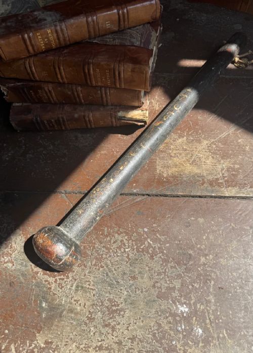 A dark turned wooden George III cudgel featuring hand-painted lettering that reads God Save The King. View IX