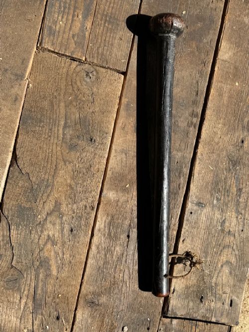 A dark turned wooden George III cudgel featuring hand-painted lettering that reads God Save The King. View XI