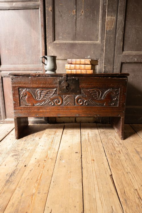 An Elizabethan Carved Oak Boarded Chest with Winged Fantastic Beasts, English, Probably West Country, Circa 1570–90
