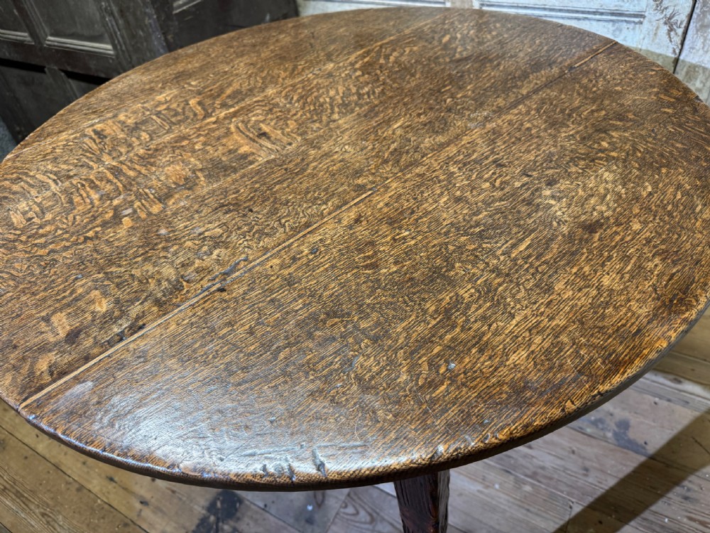 A LARGE EARLY 19TH CENTURY WELSH OAK CRICKET TABLE OF GOOD COLOUR View III