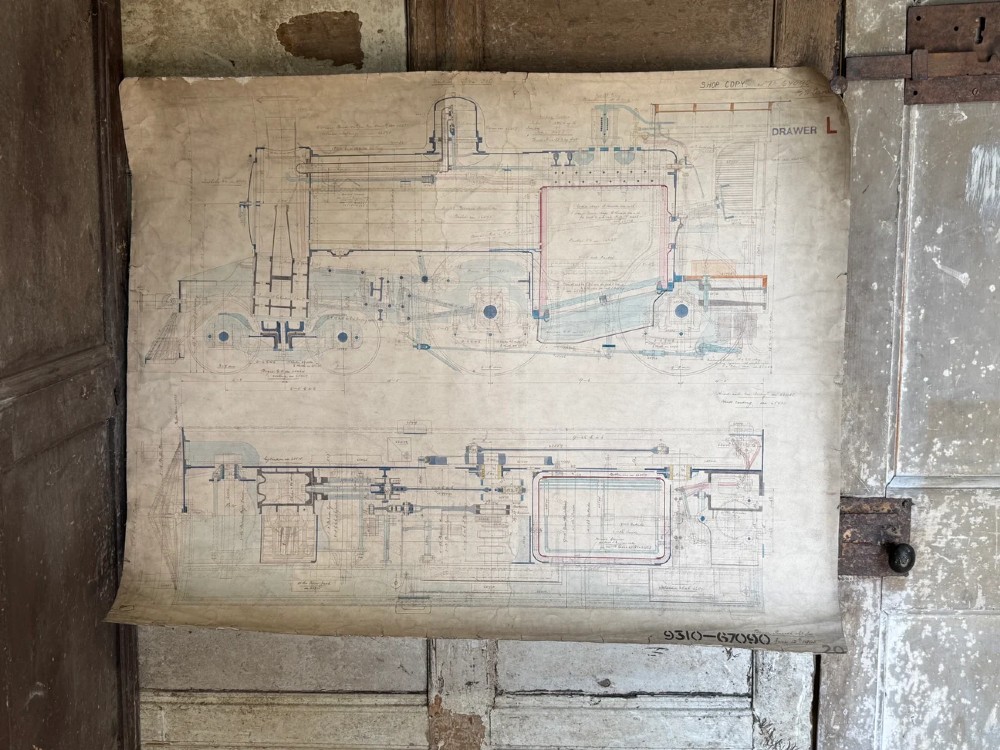 A large hand-drawn Edwardian technical engineering plan of a steam locomotive rendered in ink with coloured accents on aged paper. View VII
