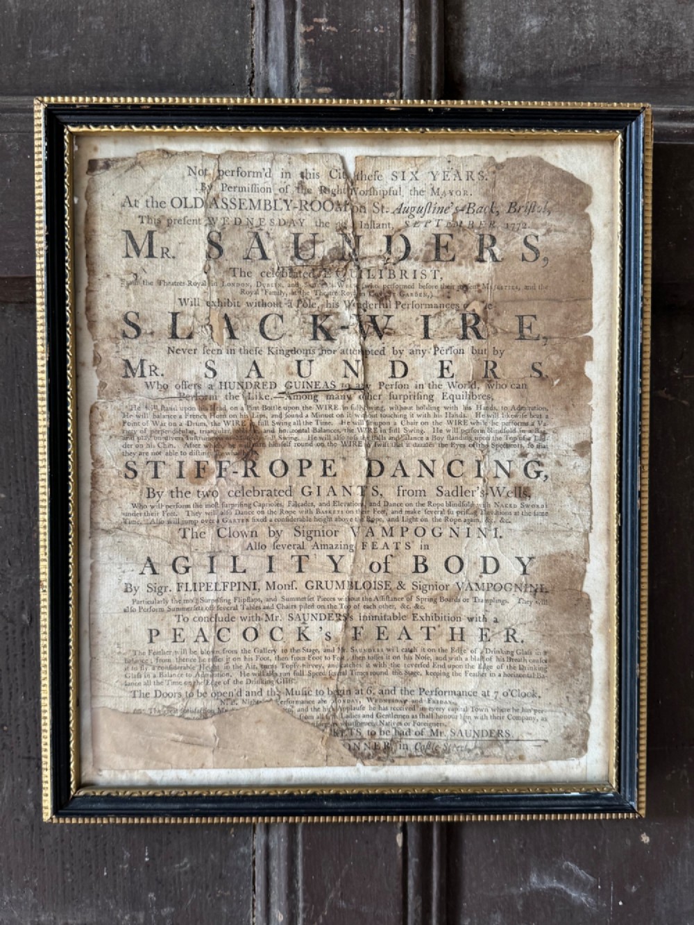 An 18th-century paper handbill with black letterpress typography advertising performance acts, displayed in a black frame with a gilt inner border. View II