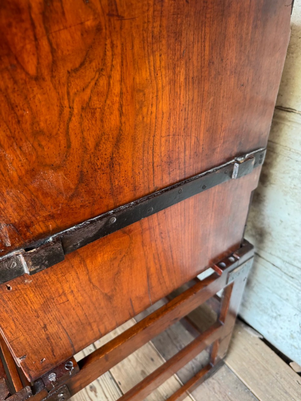 Late 19th-century Anglo-Indian campaign desk crafted from rich reddish-brown timber with flush brass handles and open frame bases. View VII