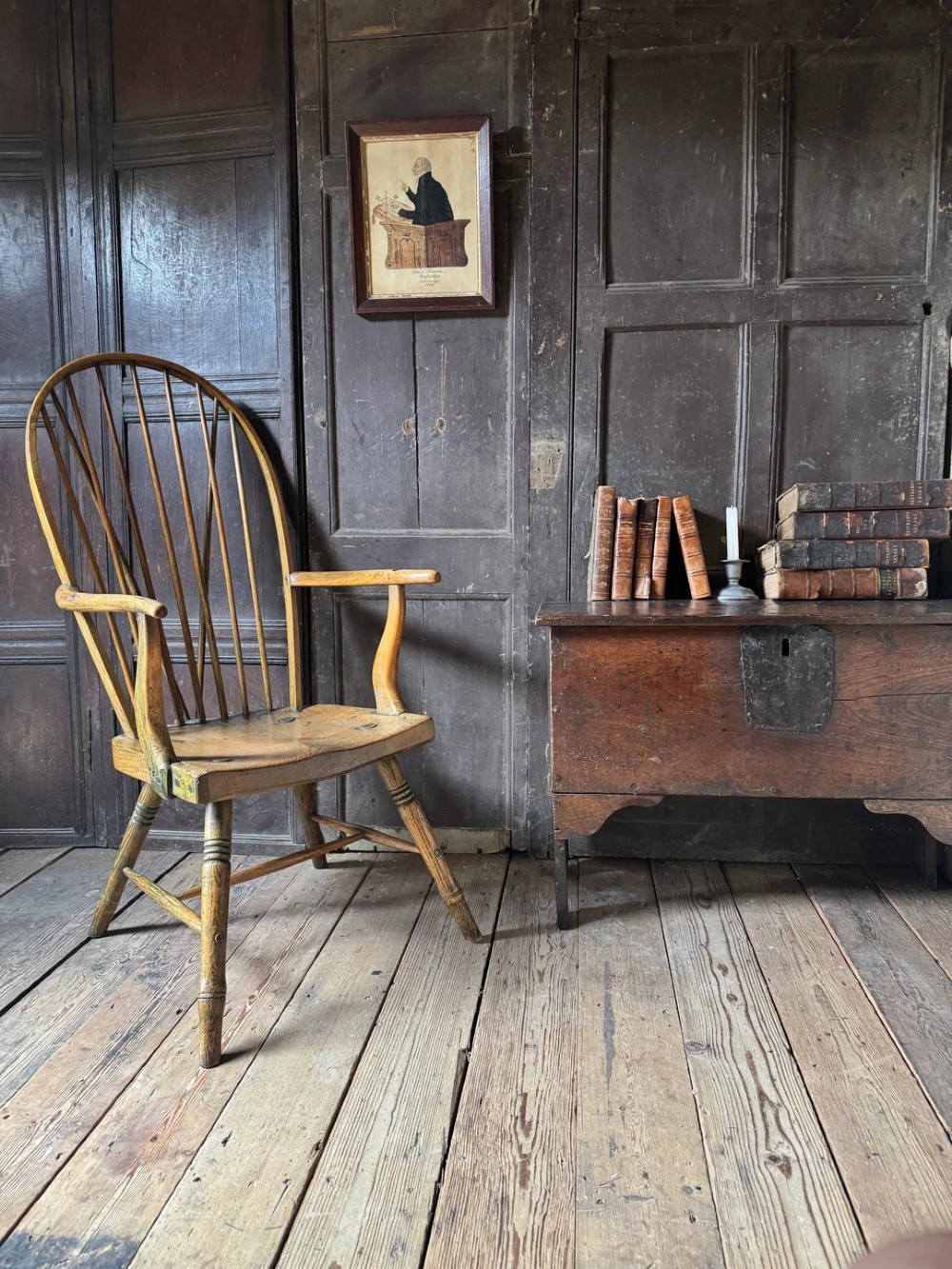 A George III high hoop-back Windsor armchair crafted from elm and ash with turned legs and a carved timber seat. View V