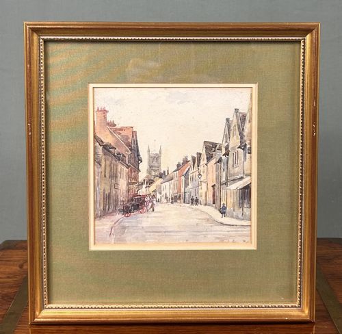 fig 2. An Edwardian watercolour painting depicting a historic street in Norwich with timber-framed buildings, a horse-drawn carriage, and a church tower in the background.