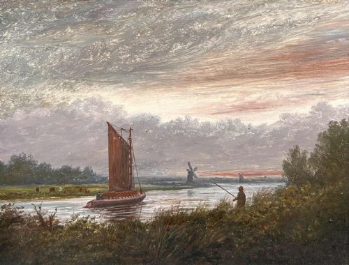 fig 1. A framed oil painting featuring a river landscape in the Norfolk Broads with a sailboat, a fisherman on the bank, and a windmill under a textured cloudy sky.
