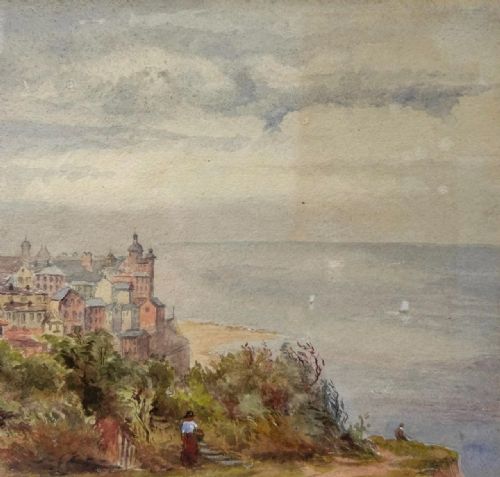 fig 3. A 19th-century watercolour landscape illustrating a coastal town with a church tower, red-roofed buildings, a grassy cliff path, and a serene sea view.
