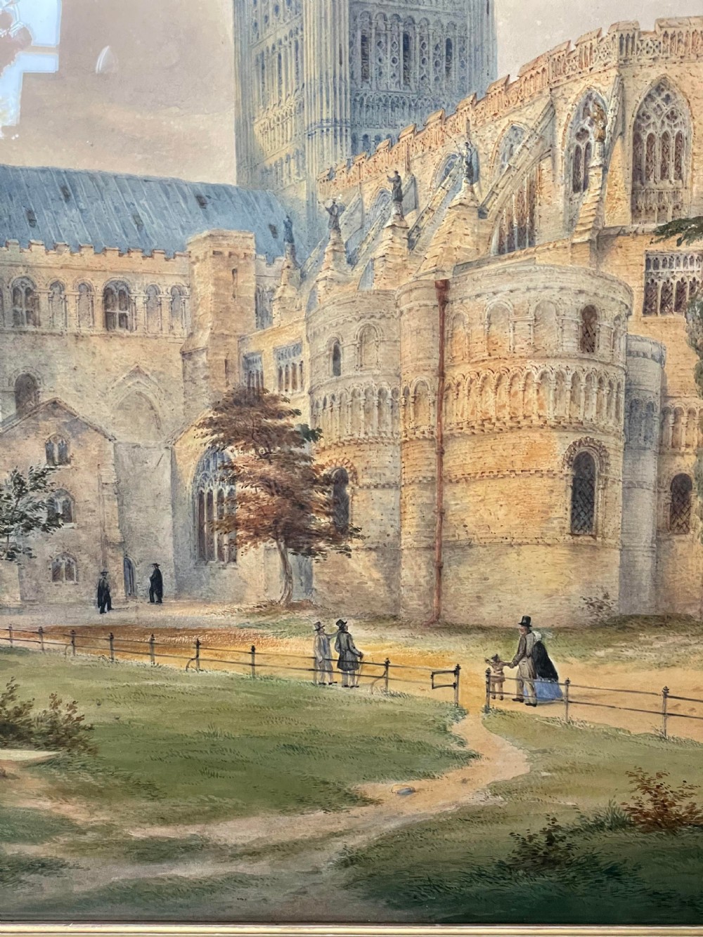 A nineteenth-century watercolour painting depicting Norwich Cathedral with a detailed spire, flying buttresses, and figures on the surrounding lawn. View IX