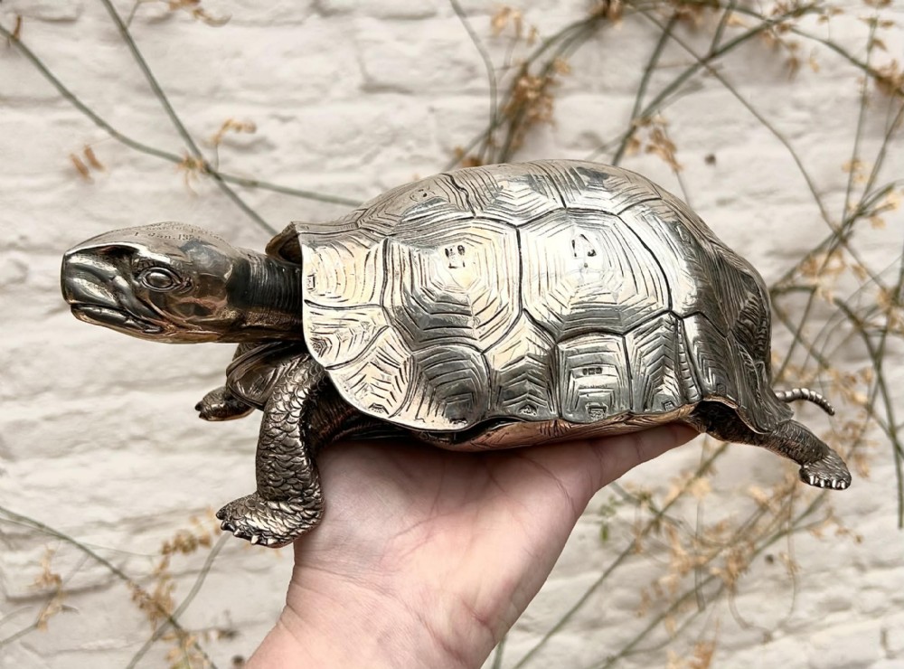 An Edwardian solid silver inkstand detailed in the naturalistic form of a walking tortoise.
