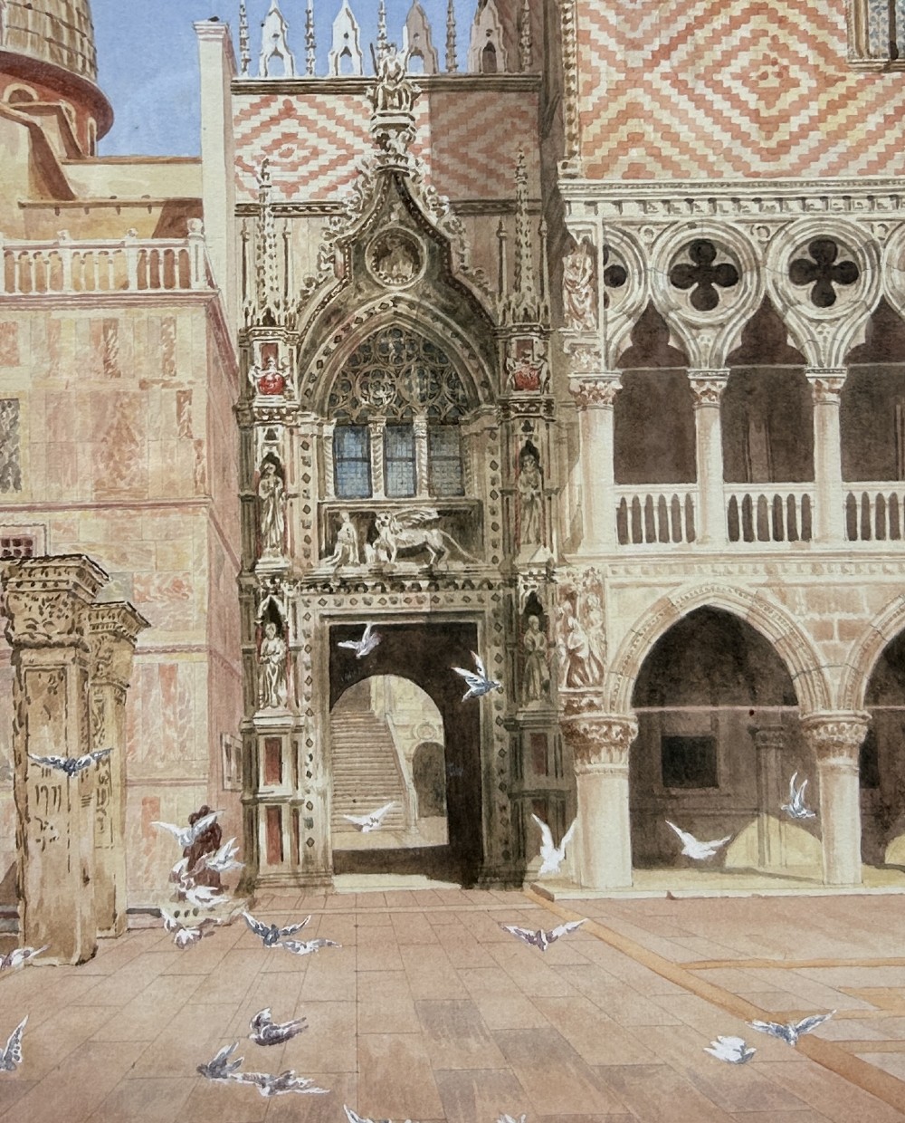 A framed watercolour painting portraying the detailed architectural facade of St Marks Square in Venice with flying pigeons, encased in an ornate gilded frame. View II