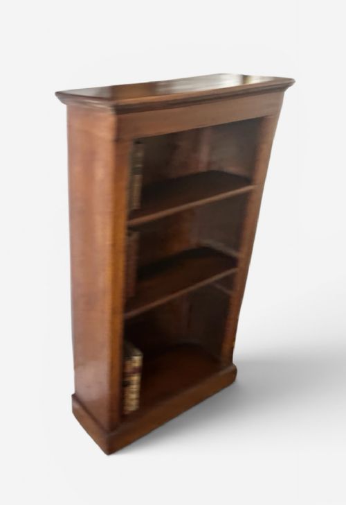 A narrow Edwardian oak open bookcase featuring adjustable wooden shelves and a simple plinth base. View III