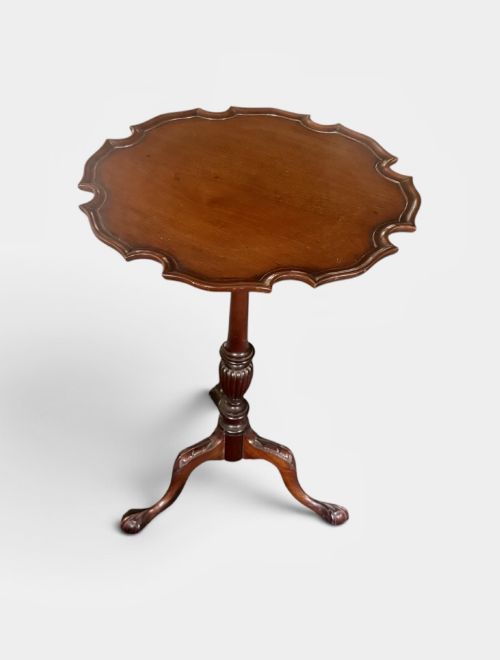 Small mahogany tripod table with shaped pie crust rim