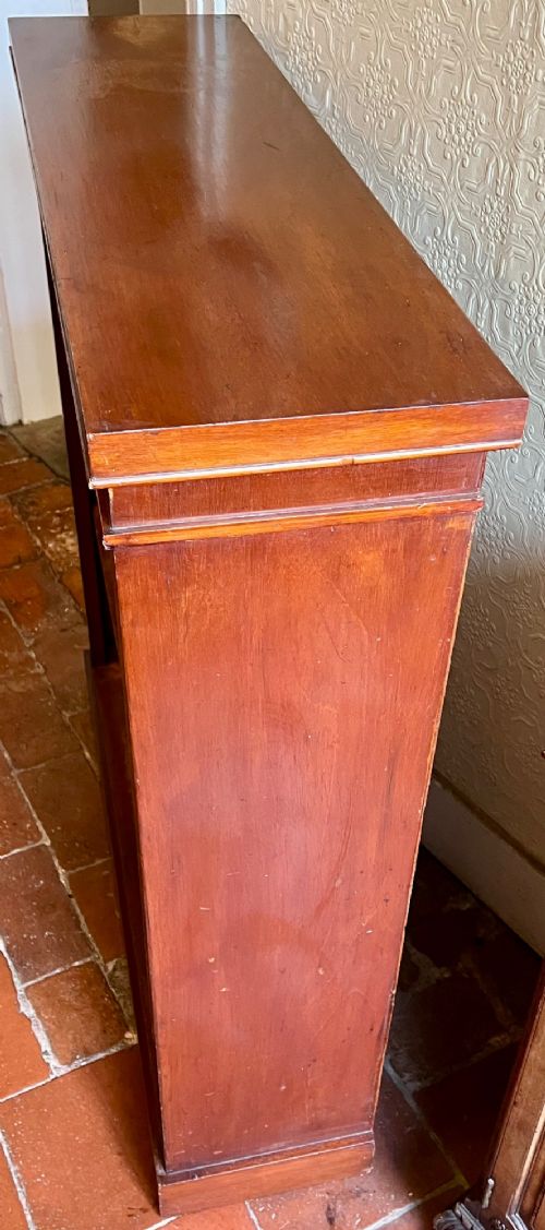 A Victorian open mahogany bookcase featuring three open timber shelves, a simple moulded top, and a plinth base. View III