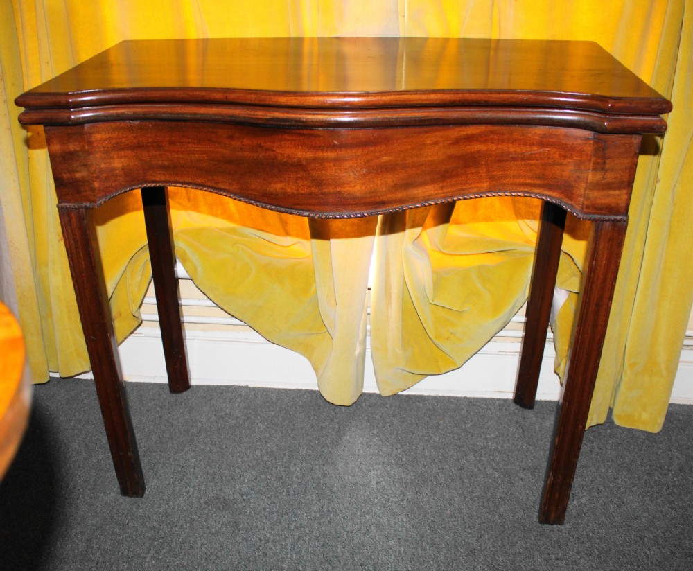 George III mahogany serpentine tea table