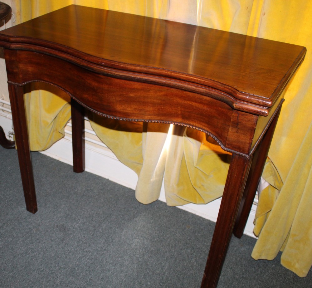 George III mahogany serpentine tea table View II