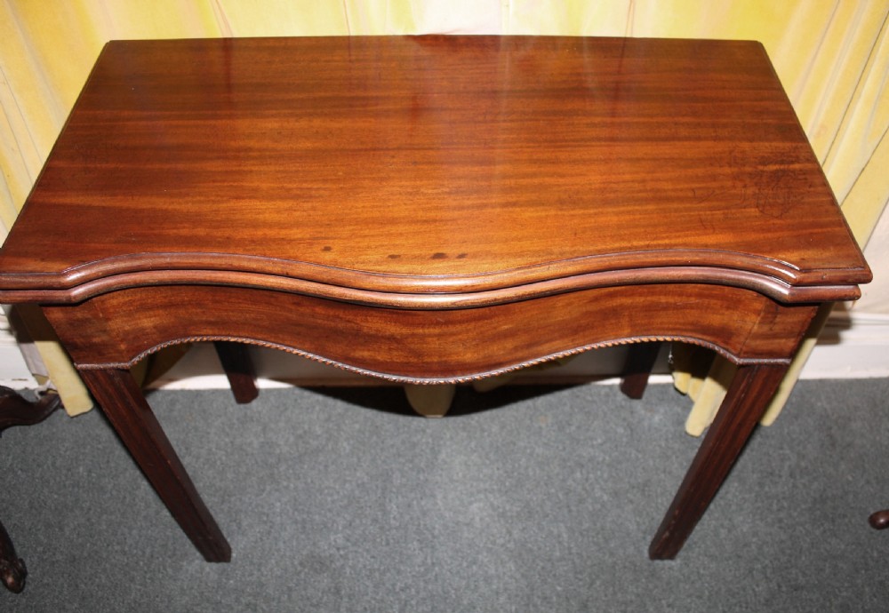 George III mahogany serpentine tea table View III