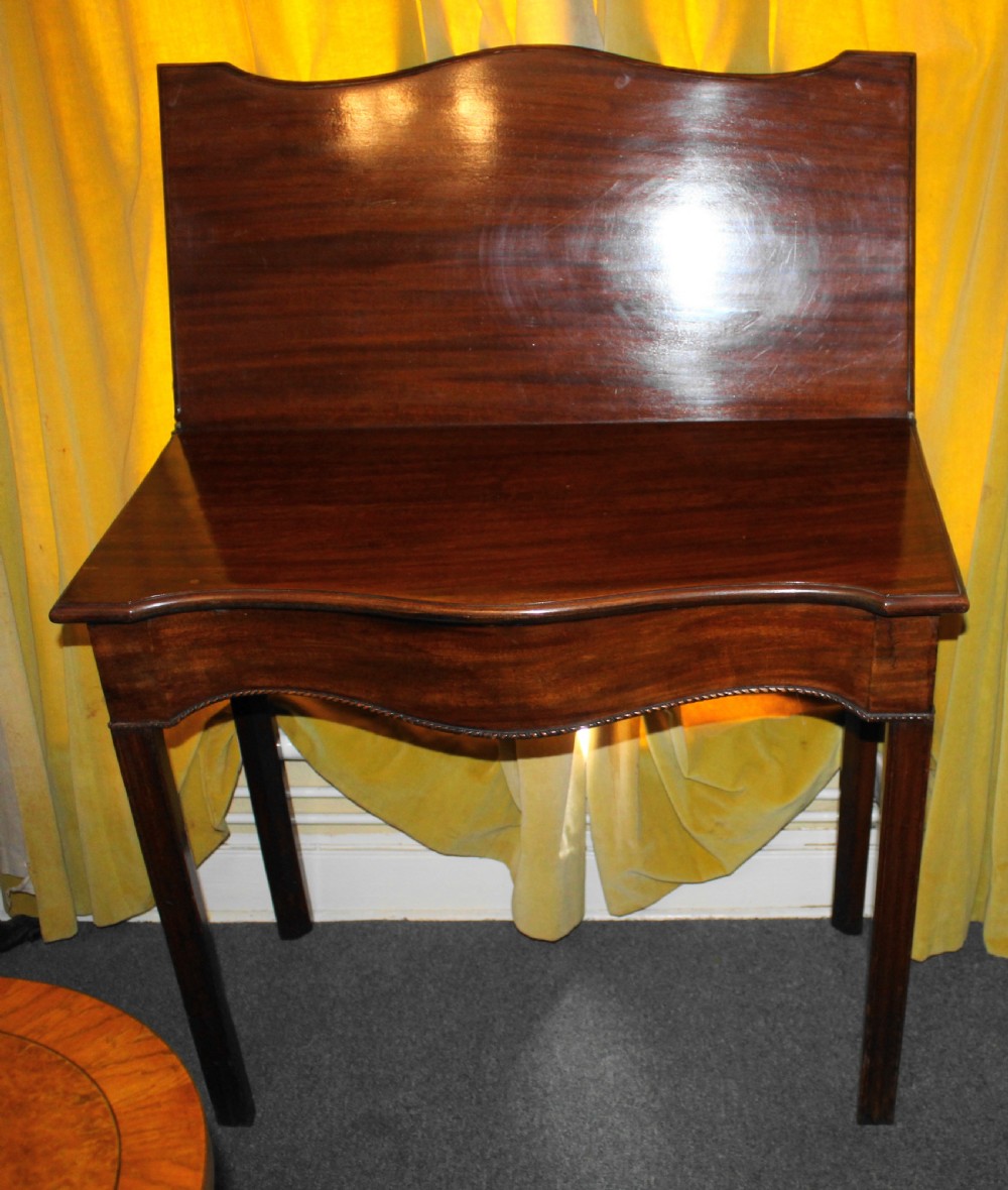 George III mahogany serpentine tea table View IV