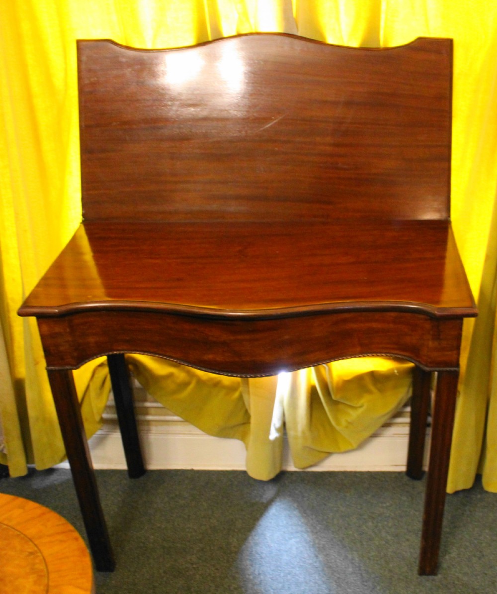 George III mahogany serpentine tea table View V