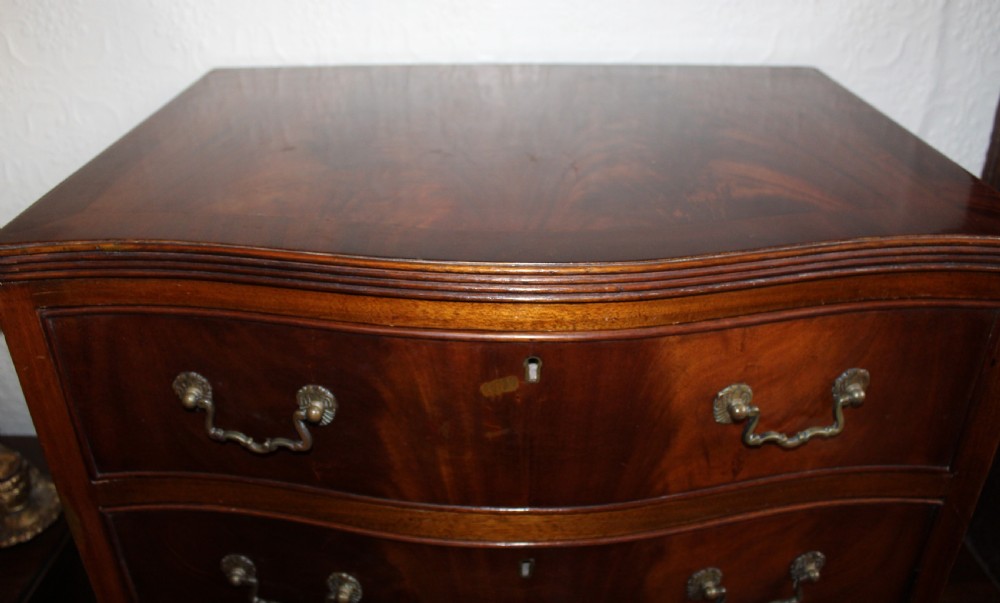 Mahogany tall and narrow serpentine chest of drawers View II