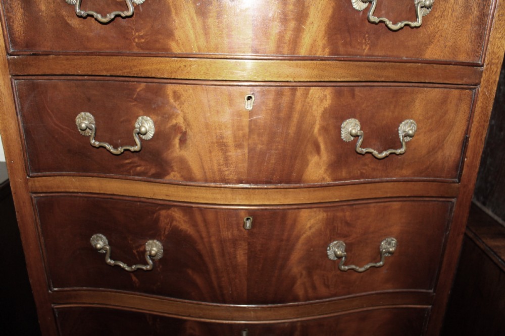 Mahogany tall and narrow serpentine chest of drawers View V