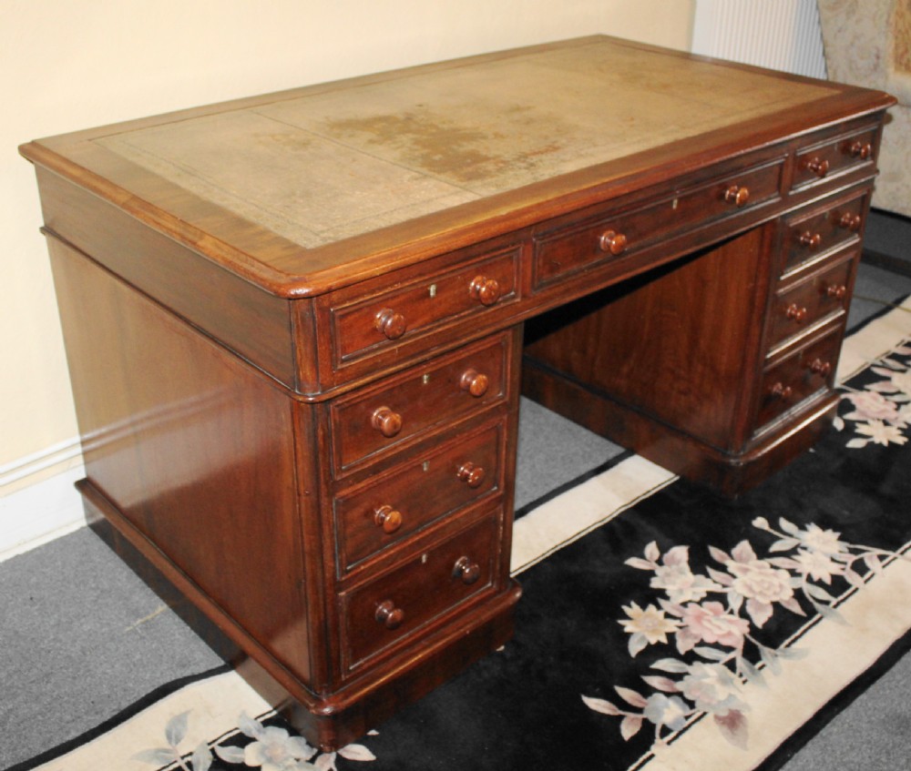 Large Victorian mahogany pedestal desk with leather top View IV