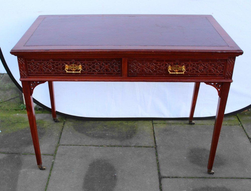 Victorian mahogany side/writing table with blind fret carving