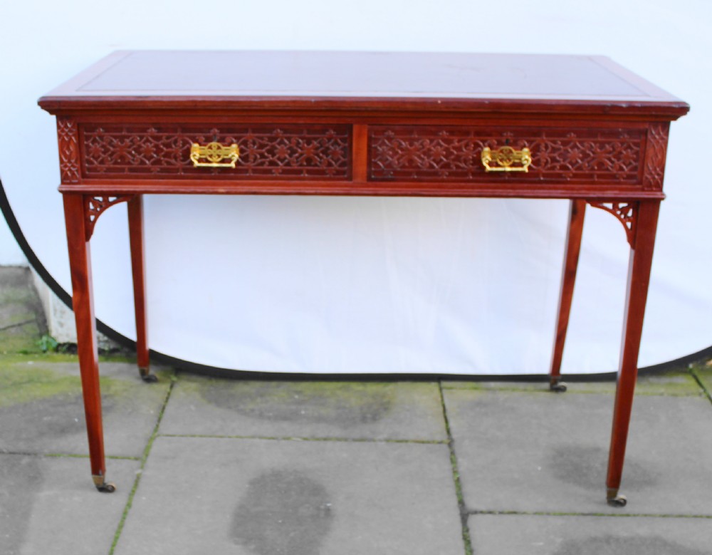 Victorian mahogany side/writing table with blind fret carving View II