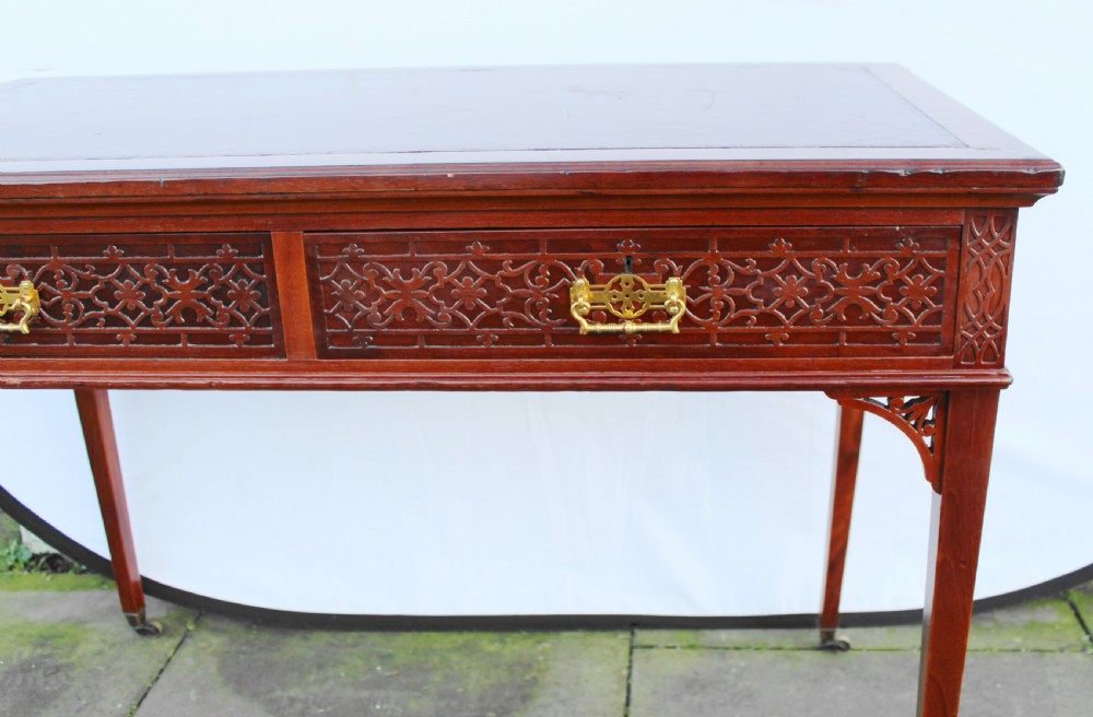 Victorian mahogany side/writing table with blind fret carving View V